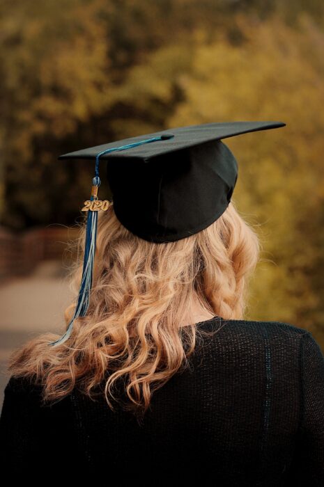 woman wearing academic hat and black academic gown